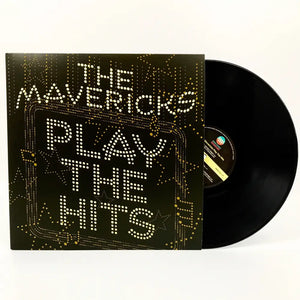 Vinyl record album titled ’The Mavericks Play The Hits’ with illuminated text on the cover.