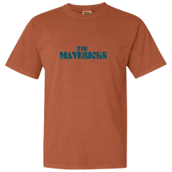 Rust-colored t-shirt with ’THE MAVERICKS’ printed in green text on the front.