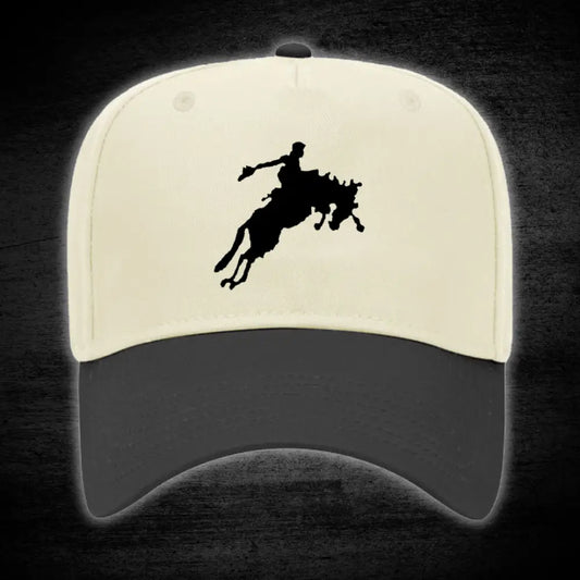 Two-tone baseball cap with rodeo silhouette.